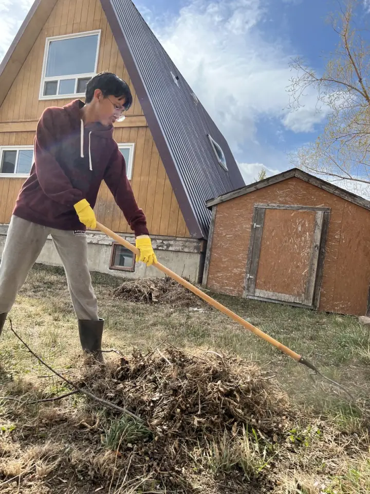RJ on the job doing yard cleanup, March 2022, first season